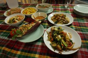 Pad Thai, papaya salad, massaman curry, panang curry, saibua soup and fried vegetables with peanuts at On's Thai Isaan in Kanchanaburi