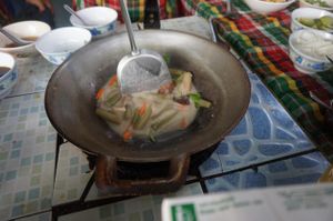 Cooking with On in her lovely small kitchen outside at On's Thai Isaan in Kanchanaburi
