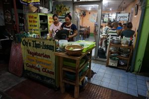 Master chef at work in her outside kitchen at On's Thai Isaan in Kanchanaburi