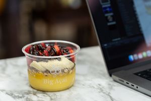 mango base with banana and strawberry and cacao drizzle at Big Acai Bowl in Fairfield