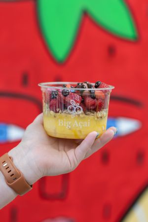 mango base with raspberries and cacao drizzle at Big Acai Bowl in Fairfield