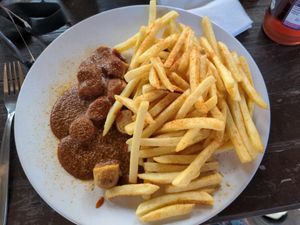 Vegan currywurst and fries at Kantine West in Freiburg