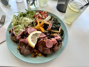 Plate of the day - sweet potato with black beans, chard, side salad  at Grumpy Mamas in Monchique
