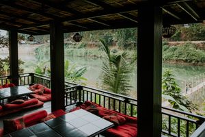We have cushions on the floor with tables and regular table with normal chairs. at Dyen Sabai in Luang Prabang