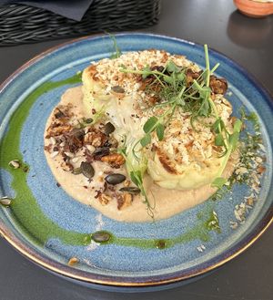 Cauliflower steak on cauliflower puree with roasted walnuts and seeds  at Wena Restaurant in Swinoujscie