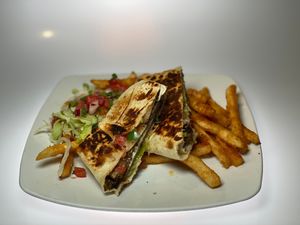 Black Bean Memelas: Kinda like a black bean burger but better! Flour tortilla filled with black bean patty, pico de gallo and lettuce.  Served with salsa of the day. at Franklin Inn in Pittsburgh