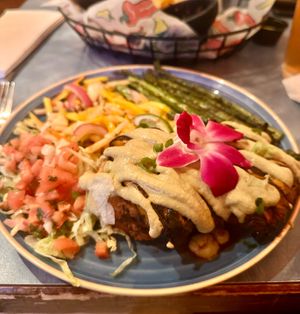 Sweet potato and poblano cakes topped with mushrooms and sunflower crema. Accompanied by grilled asparagus and mango and jicama slaw.  at Franklin Inn in Pittsburgh