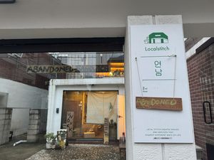  Lights on, no one home. Boxes stacked indoors   at Abandoned Sandwich - 언덕 UNDUCK in Seoul
