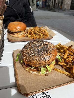 Two plates of burgers and fries  at Ginsburger Vegetarian Superstar in Paris
