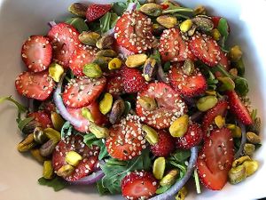 Strawberry Arugula Salad: Organic arugula, organic strawberries, red onions, pistachios and hemp seeds with our Poppyseed dressing. at FengFit Foods in Pepper Pike