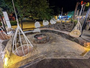 Chillout area next to a fire at Inti Garden in Puerto Baquerizo Moreno