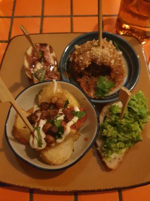 From top L: Fig&goats cheese crostini; Meatball in tomato redwine sauce; Smashed pea, mozzarella, mint crostini; Patatas bravas at Follies in Fitzroy