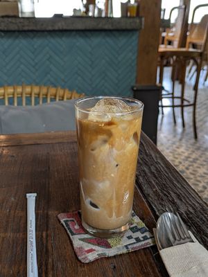 Iced Latte with Almond Milk at Roots  in Canggu