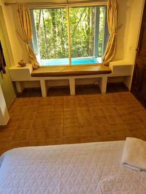 Room with pool view at Treehouse Cerro Azul in Panama City