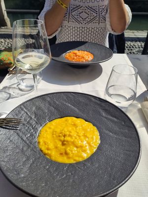 Vegan version safrano risotto and vegan version of a tomato risotto, both very tasty at Officina del Riso Navigli in Milan