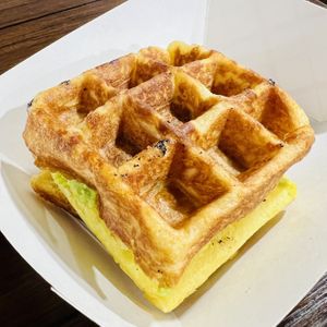 Vegan Sausage & Egg on Waffle breakfast sandwich with avocado  at Grandma's Ice Cream & Waffles in Rockville