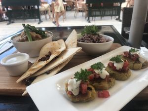 Indian potato cakes & Sweet potato peanut curry  at La Plaza in Malaga