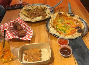 "chicken" curry pizza, sausage and pepper pizza, "chicken" strips and cauliflower bites 😋 at Pings in Kilmarnock