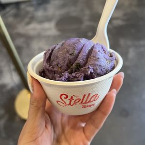 split scoop of ube spooky cookie and strawberry crumblee  at Stella Jean's Ice Cream in Costa Mesa