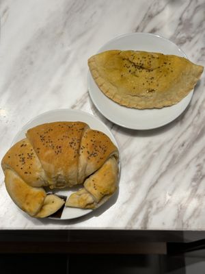 Tasty Vegan Ham and Cheese Croissant (left) and Potato and Spinach Empanada  at PURALMA Vegan Bakery in San Jose