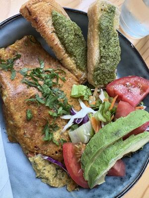 Omelette comes with salad and bread with amazing pesto spreadd  at PURALMA Vegan Bakery in San Jose