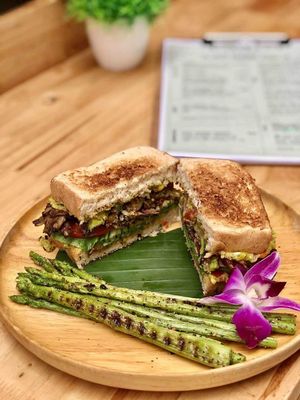 Spicy Avocado Sandwich

House-Made Creamy Guacamole, Bok Choy & Sliced Tomato on Vegan Sandwich Bread. Very Delicious Combination Spices and Herbs at Herban Cafe in Bangkok