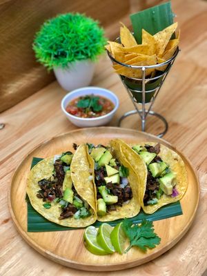 Tacos
Asada Tacos, your choice of Three Corn or Flour Tortillas filled with grilled Mushrooms seasoned in Mexican Spices. In House-Made Vegan Cheese, Salsa, Guacamole & Jalapeños at Herban Cafe in Bangkok