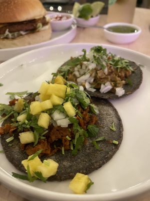 Chili burger in the back. Chicharrón and pastor tacos   at The Forward Thinking Eatery in San Jose Del Cabo