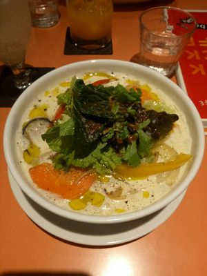 Vegan ramen (soy milk) from the seasonal menu. Slices of potato, carrot, capsicum and eggplant at Kick Back Cafe in Tokyo