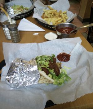 Sandwiches with fries and hot sauce at Falafels in Bloomington