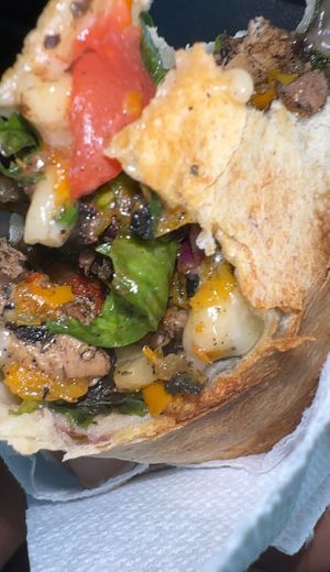 The gooey inside of the jerk wrap at 2 Phat Vegans in New Orleans