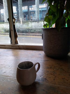 Coffee at the window bar at The Cosy Cafe in Hay-on-wye