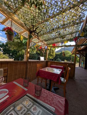 Exterior terrasse in August evening at Momo Hut in Briancon