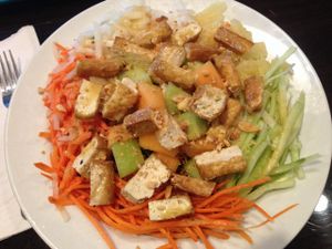 Daily special salad with lettuce, melon, carrot, pineapple, jicama & tofu. Citrus vinaigrette dressing. at Bamboozle Cafe in Tampa