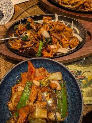 Tofu in black bean sauce and veg & tofu in satay sauce at The Rice Bowl in Manchester