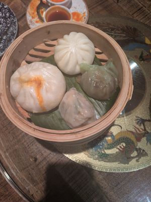 Bao bun and dumplings with veg, kimchi, and mushroom fillings. at The Rice Bowl in Manchester