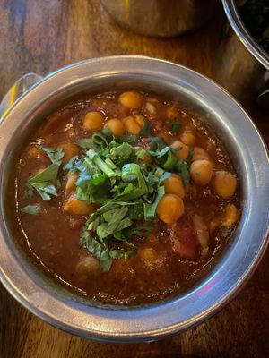 chana masala - Chickpeas in an onion tomato masala gravy. Served with steamed basmati  at Ghee Indian Kitchen in Kendall