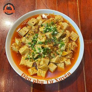 Our Sichuan-style Tofu is a must-try! 🔥🍜 Soft tofu is braised in a rich, spicy, and aromatic sauce, packed with bold flavors that will leave you craving more. at Toàn Mán Restaurant  in Ta Van