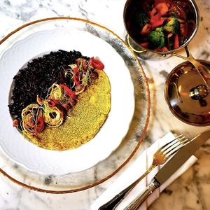 Red lentils curry and flatbread, black rice, pickled chilies and paracuca. at Remédio Santo - Baixa in Porto