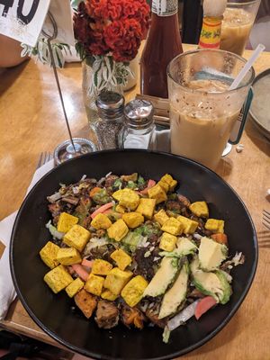 Tempeh and grain bowl with a churro iced latte. at Marigold Kitchen in Madison