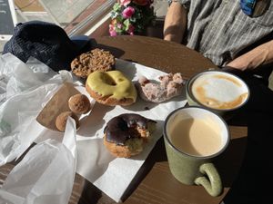 Chai Latte and Cappuccino, Mochi Balls, Passion Fruit, Hot Chocolate and Apple Donuts, Blueberry Pie - some already esten 😅  at Vio Handcrafted Pastries in Vacaville
