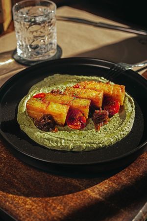 Bastones de patata con crema de anacardos y albahaca  at Baobab Soul Kitchen & Bar in Alicante