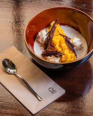 Panna Cotta de coco y vainilla con fruta y chocola en rama casero

 at Baobab Soul Kitchen & Bar in Alicante