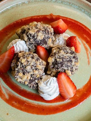 Trufas veganas de chocolate, avellana y cafe con crema de vainilla y fresas at Baobab Soul Kitchen & Bar in Alicante
