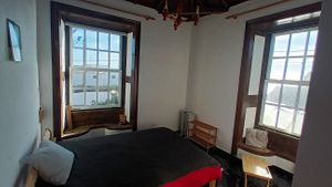 the room with two big windows facing the ocean at Casa del Mar in La Palma