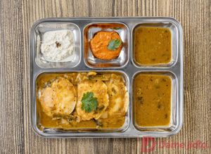 Idili - Is a steamed Indian dumpling made of rice and lentils served with lentil soups called sambar and two types of chutney's  at Dookan Dosa Bistro in Prague