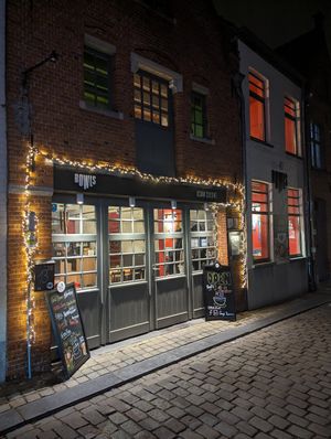 the facade at nighttime at Bowls in Bruges