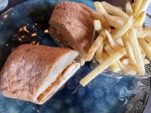 Fishfingerless ciabatta and fries   at Oscar's Cafe in St Neots