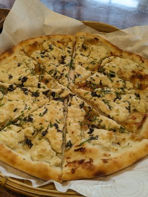 Pizza with cashew cheese at The Kind Roastery and Brew Room in Bangalore
