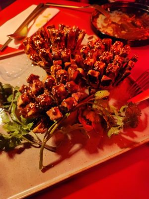 Blooming Fields of Eggplant. Crispy eggplant flower with homemade soy cream. Another delicious dish for an eggplant lover. The soy cream is extremely salty and cries for rice. at Green Light District 红灯区 in Dusseldorf